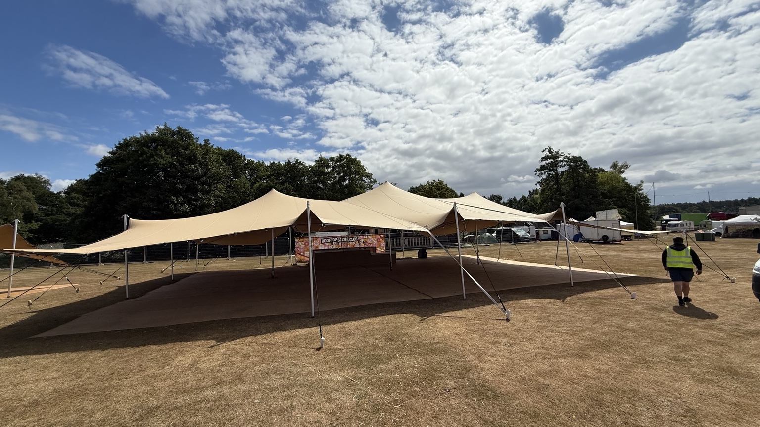 Large tan stretch tent installation